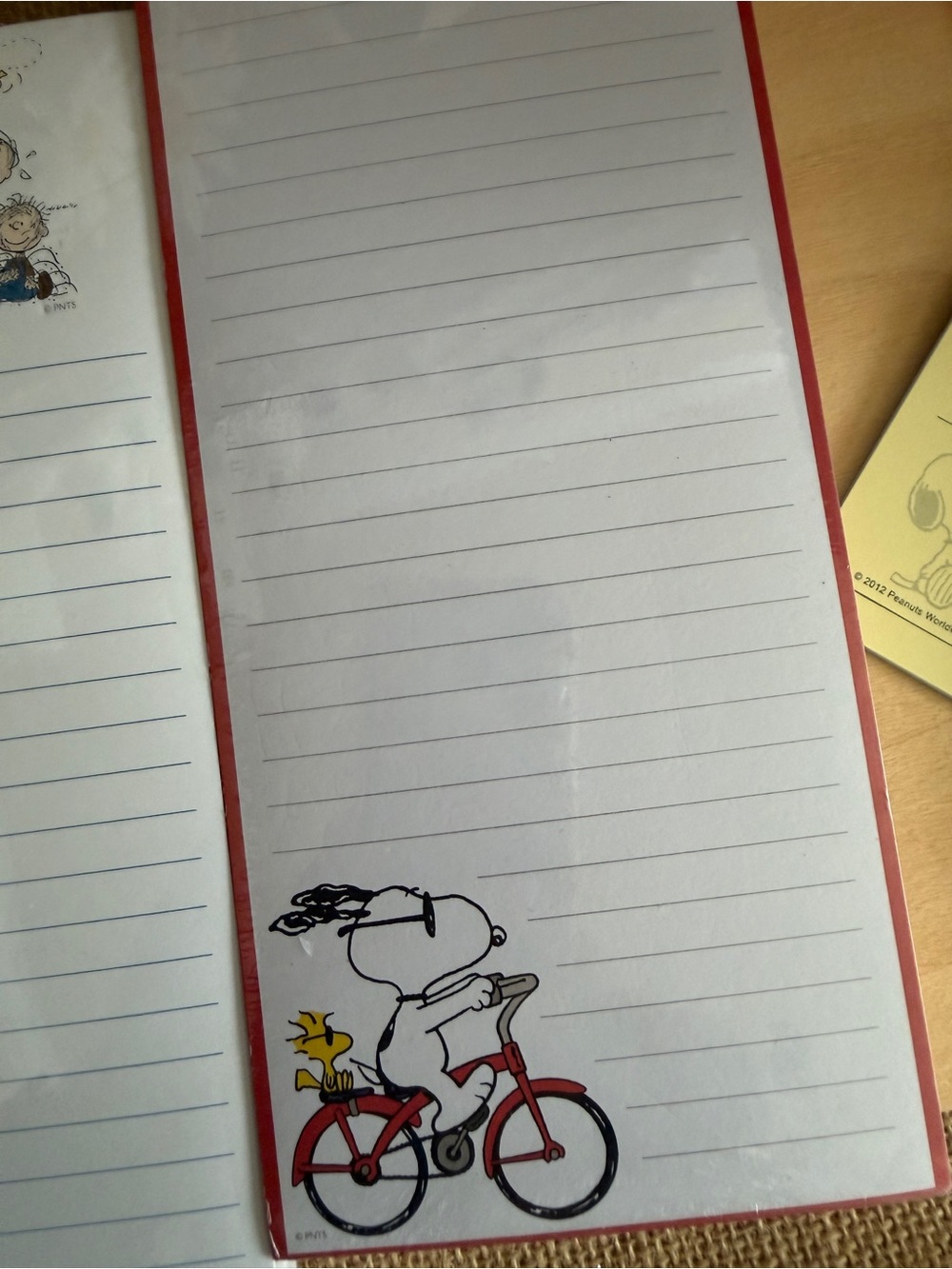 Peanuts White & Red Lined Notebook with Snoopy Bike Illustration